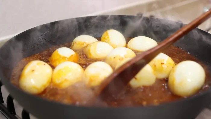 Add the peeled eggs and simmer for 7 minutes.