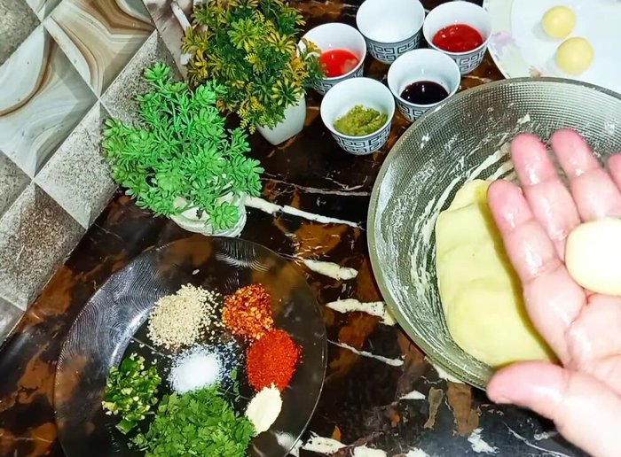 Heat water in a pot until very hot (not boiling). Gently add the potato balls.