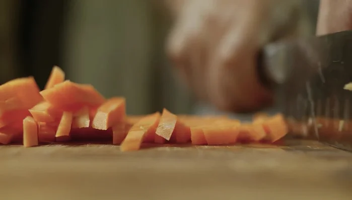 Add julienned carrot and mix it into the seasoning paste.