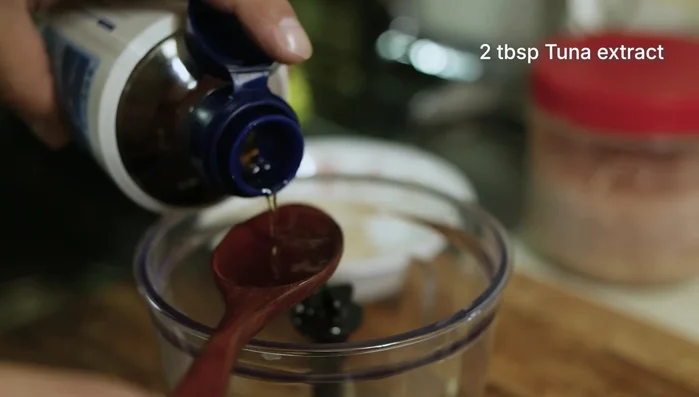 In a blender, add plum syrup, fermented shrimp, and tuna extract first. Then add onion, garlic, and cooked rice. Blend until smooth.