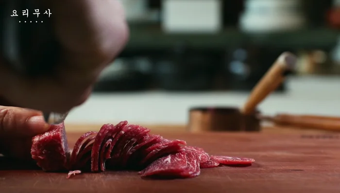 Slice the beef as thinly as possible.