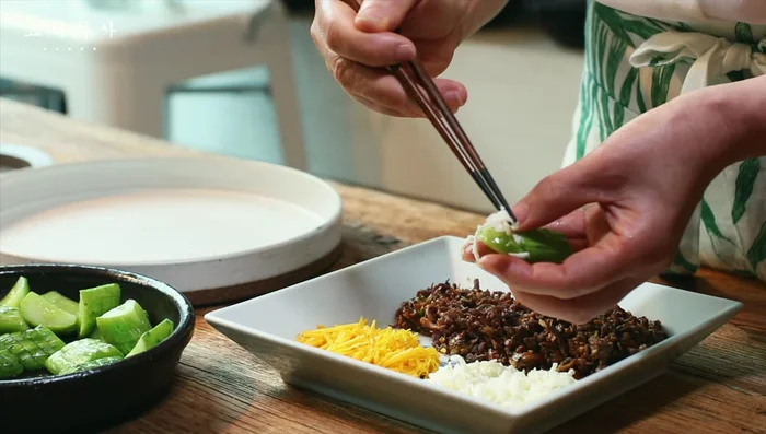 Fill the cucumber boats with the prepared filling.