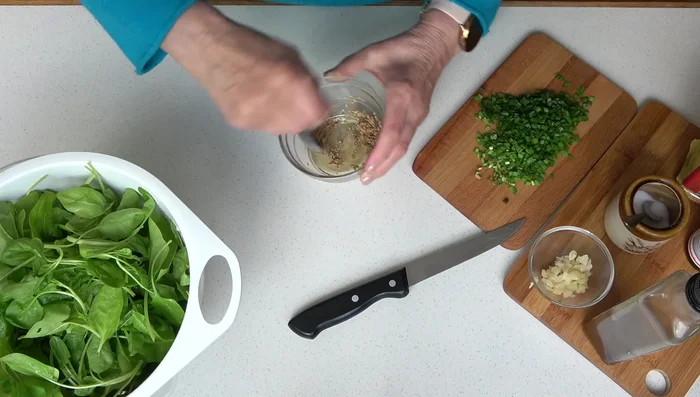 Prepare the sauce: In a bowl, combine soy sauce, a pinch of salt, and sesame seeds. Mix well.