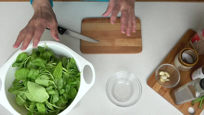 Clean and wash the baby spinach.