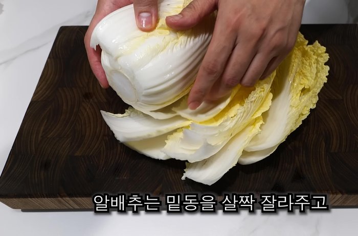 Cut off the bottom of the cabbage and chop the cabbage leaves into large pieces.