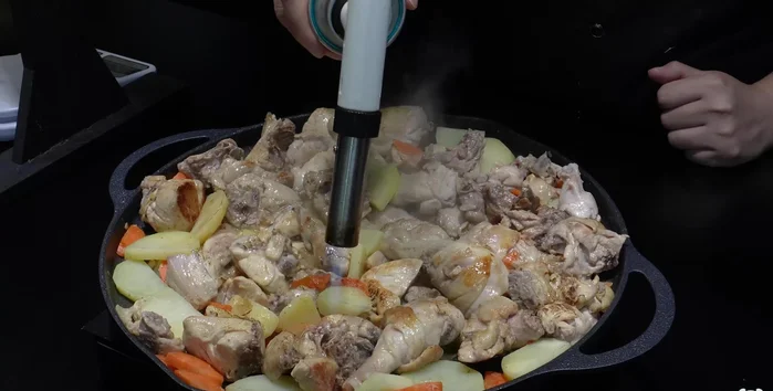 When the chicken is golden brown, add the cabbage, onion, and rice cakes to the pan.