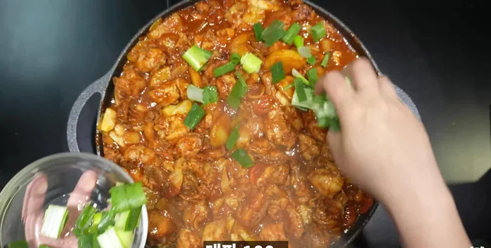 Add green onions, green chili peppers, and red chili peppers.
