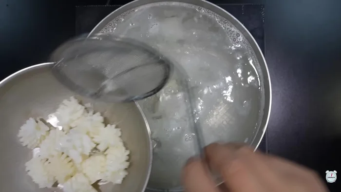 Insert a slice of string cheese between each piece of blanched squid.
