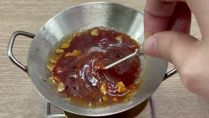 Add the boiled octopus to the tomato sauce mixture.