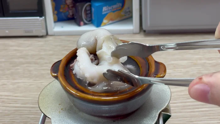 Boil the octopus in salted water with cinnamon, lemongrass, and garlic.