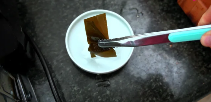 Prepare kimchi paste (Part 2): Remove sea kelp (discard or eat as a snack). Blend the soaked rice and anchovies until liquefied. Add apple, onion, radish, garlic, saeujeot, ginger, fish sauce, and plum extract syrup to the blender. Blend until smooth.