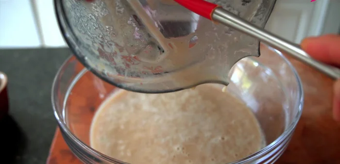 Combine ingredients: Pour the blended mixture into a large mixing bowl. Add gochugaru and optional finely ground gochugaru. Mix until the white starch disappears. Let it rest for 5-10 minutes for the color to brighten.