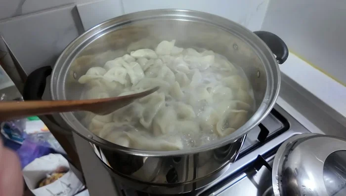 Boil the dumplings: Bring a pot of water to a boil. Add the dumplings and cook until they float to the surface and are fully cooked. Add cold water several times during boiling to maintain a gentle simmer.