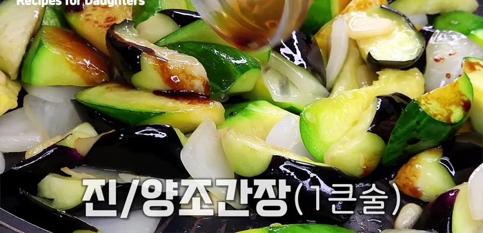 Season with soy sauce, sugar, and green chili peppers. Stir-fry well.