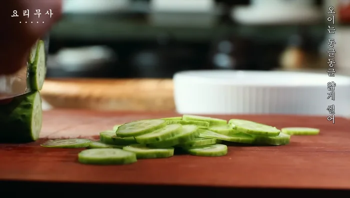 Slice the cucumber into thin round pieces.