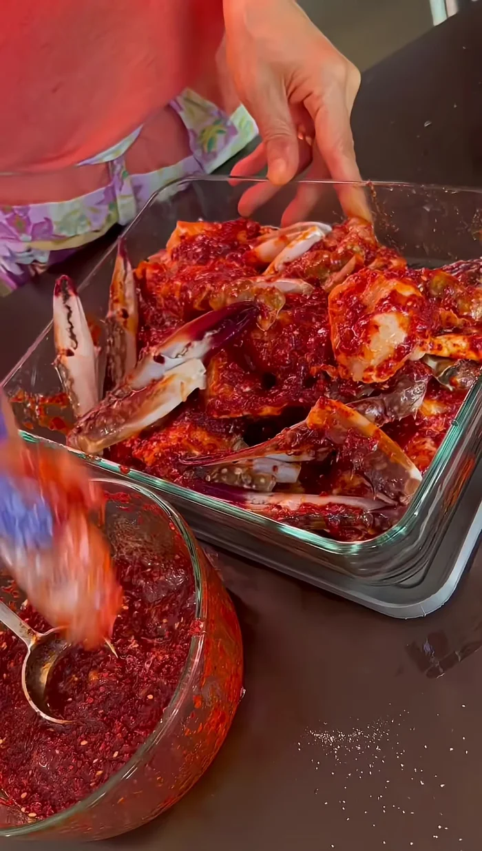 Pour the marinade over the crab, ensuring it’s fully coated.