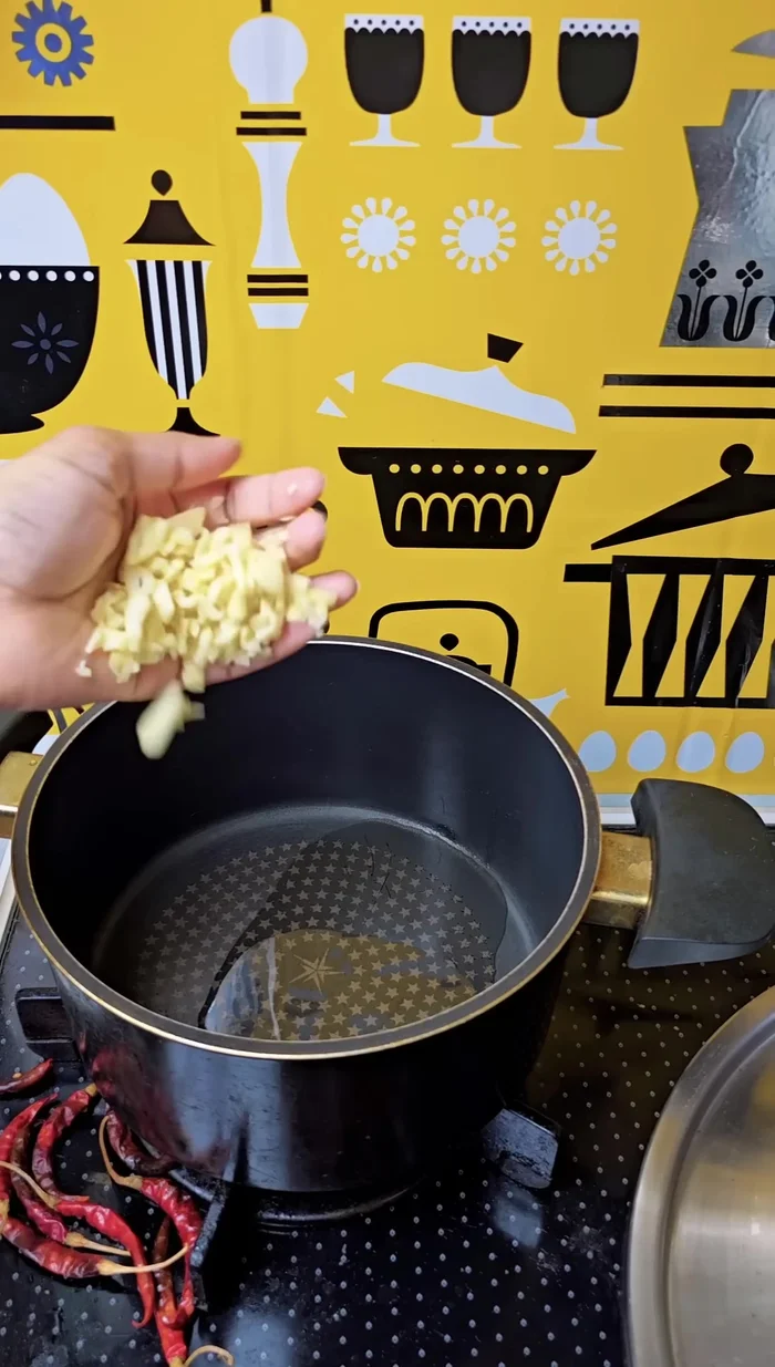 Add oil (preferably Parelia oil), lots of garlic, and stir.