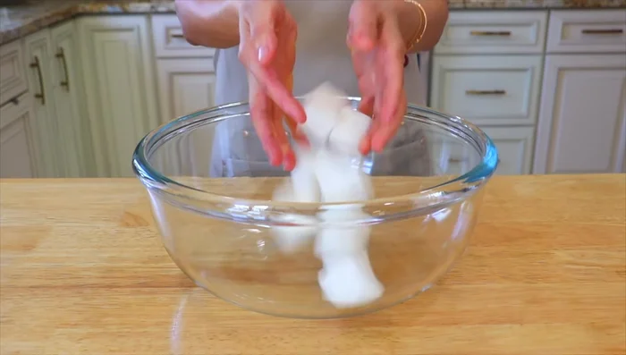 In a large bowl, add the radish cubes and sprinkle with salt. Let it rest for 15 minutes, then rinse and drain, reserving about 3 tablespoons of the radish liquid.
