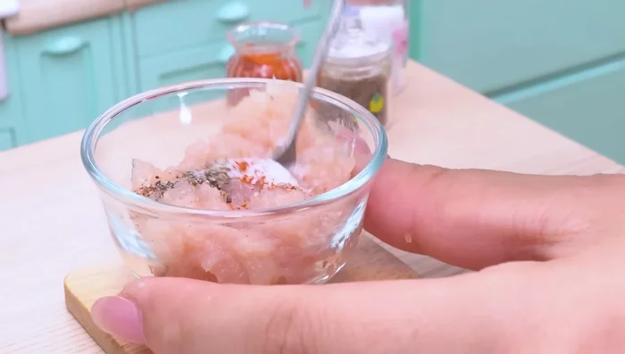 Add spices to the chicken and mix well by hand.