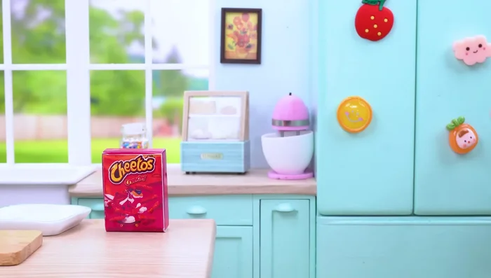 Crush Cheetos into pieces.