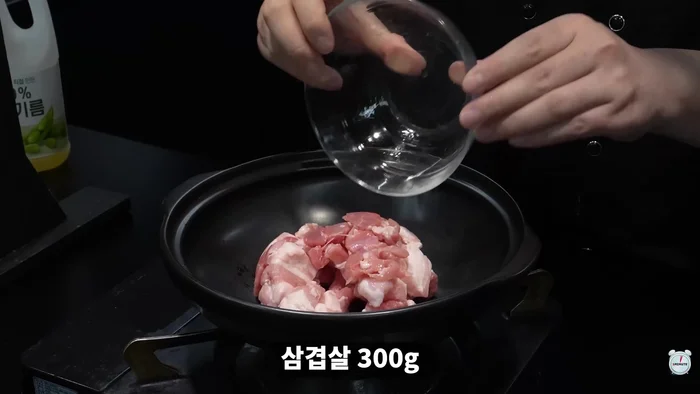 Add pork belly and stir-fry until golden brown. Set aside.