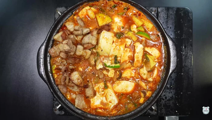 Add the previously set aside pork belly.