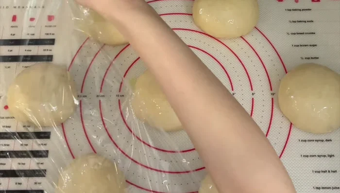 Lightly brush the buns with oil, cover loosely, and let rise for 60-90 minutes, or until doubled.