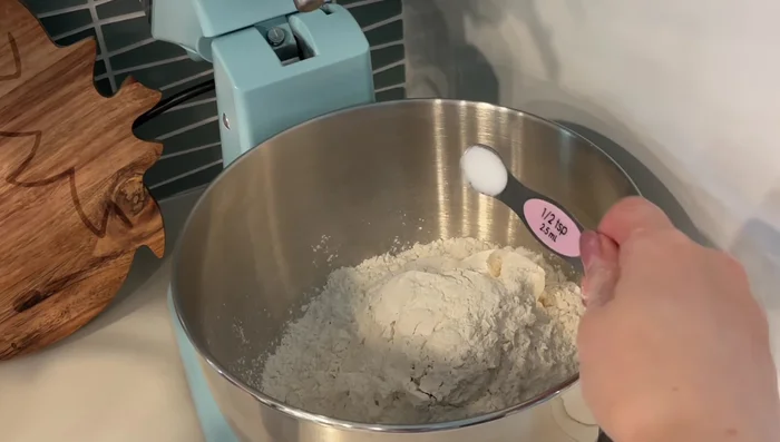 Combine all-purpose flour, salt, powdered milk, sugar, and instant yeast. Mix quickly.