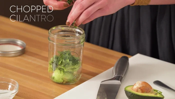 Prepare the dressing in a mason jar: Add avocado, 2 tablespoons of cilantro, 2 tablespoons of lime juice, extra virgin olive oil, a pinch of salt and pepper, and 1/4 cup of plain yogurt. Shake well.