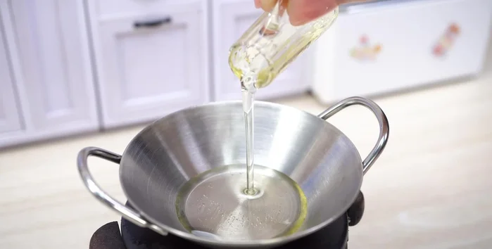 Add cooking oil, garlic, and onion.