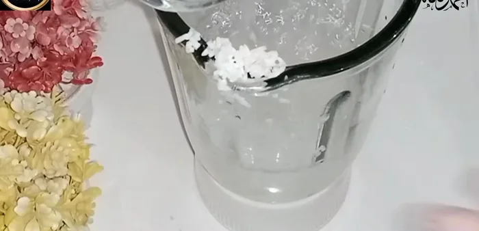 After soaking, blend the soaked rice with the water in a mixer.