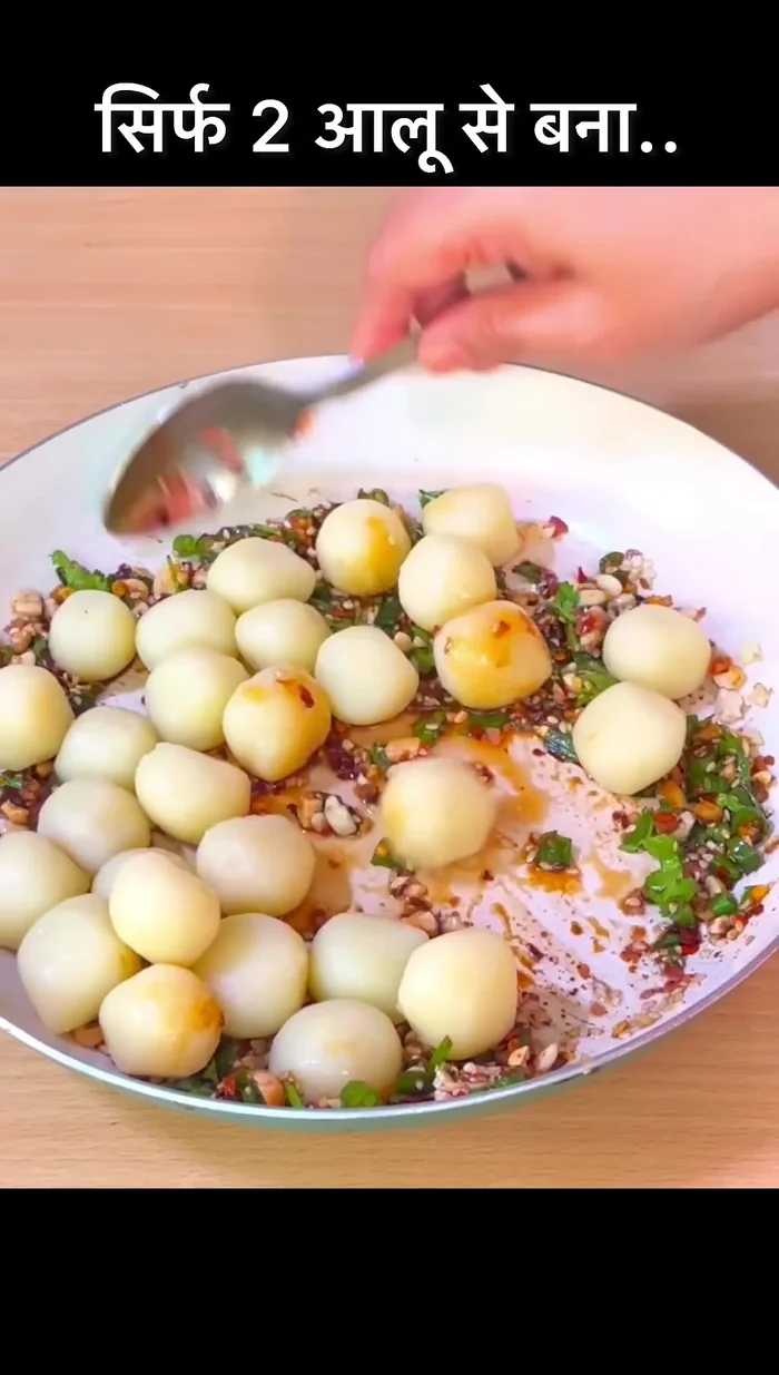 Add the potato balls to the pan and mix well.
