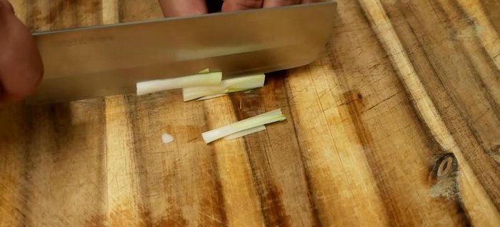 Roughly chop onion, spring onion, red chili, and garlic. Prepare other veggies (bean sprouts, carrots, peppers, cabbage).