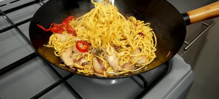Add garlic, red chili, and spicy Korean sauce. Stir-fry until sauce reduces and caramelizes.
