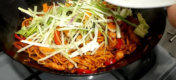 Add veggies and spring onions. Warm through for 20-25 seconds.