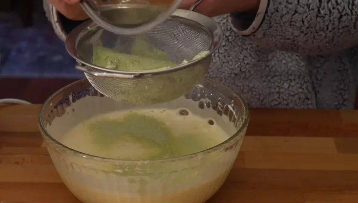 Gently fold the dry ingredients into the egg mixture in batches.