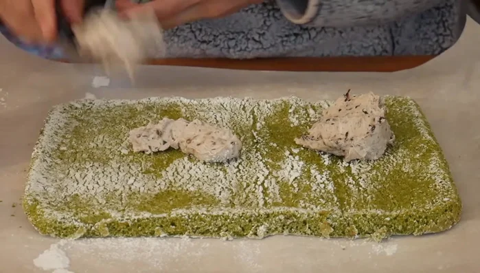 Once cool, carefully unroll the cake. Spread the red bean whipped cream evenly over the cake.