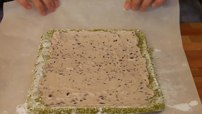 Reroll the cake and dust generously with powdered sugar before serving.