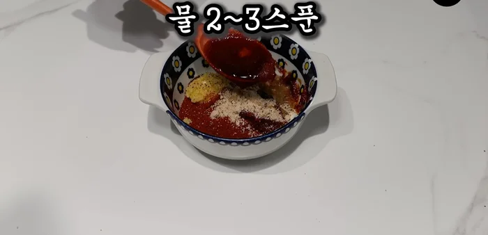 Add 2-3 spoons of water to moisten and mix.