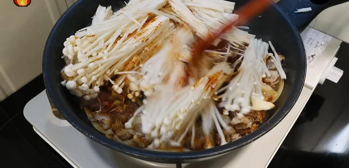 Add the shiitake mushrooms and stir-fry gently over low heat.