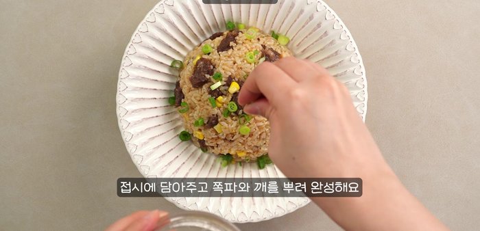Add the cooked rice to the pan and mix well with the beef and butter.