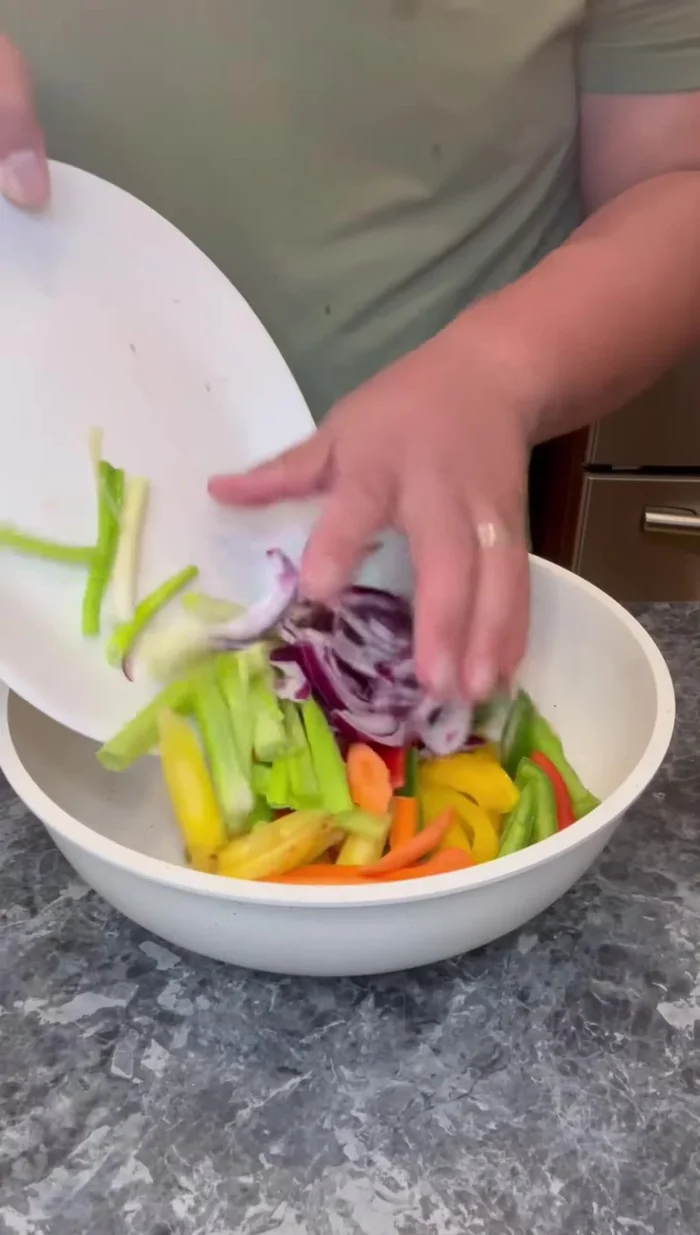 Fry the vegetables in a pan until softened.