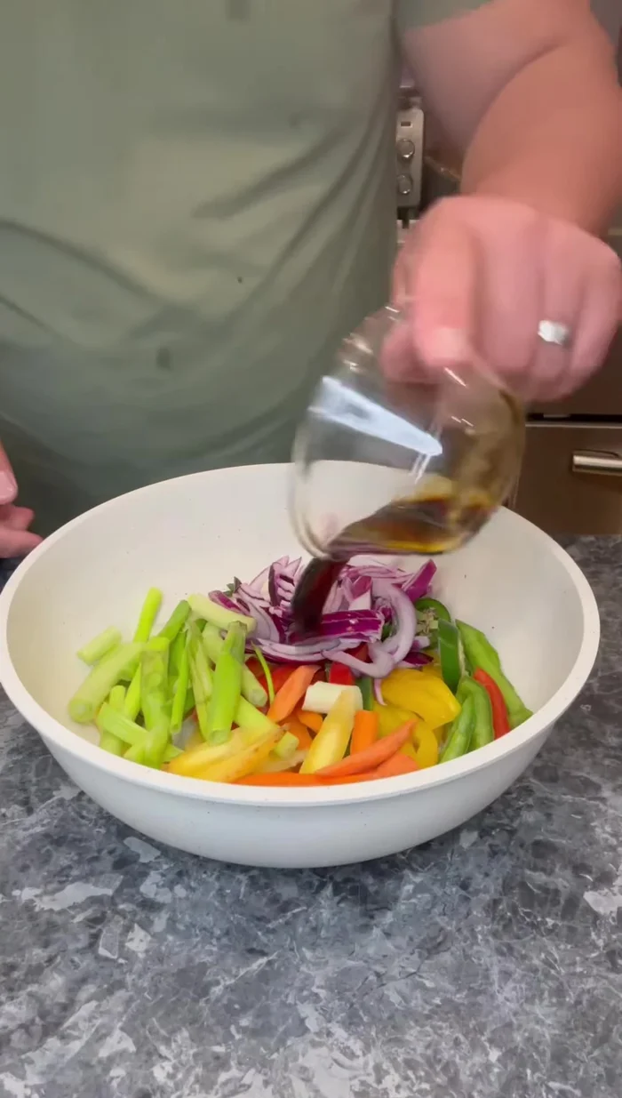 Add the soy sauce, garlic, sugar, ginger, and Korean red pepper paste to the pan with the vegetables and stir-fry.