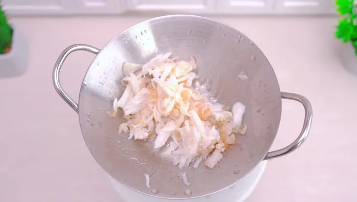 Add shrimp, turmeric powder, and salt.