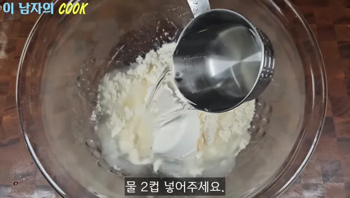 In a measuring cup, combine 2 cups of tempura flour, 2 cups of water, and 2 spoons of tuna liquid. Mix well to form a batter.