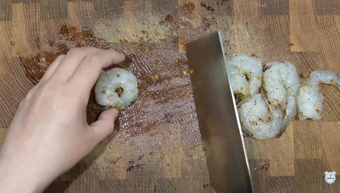 Cut rice paper into four pieces and place the shrimp on top.
