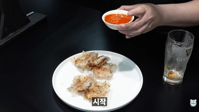 Add purple cocktail shrimp to a bowl.