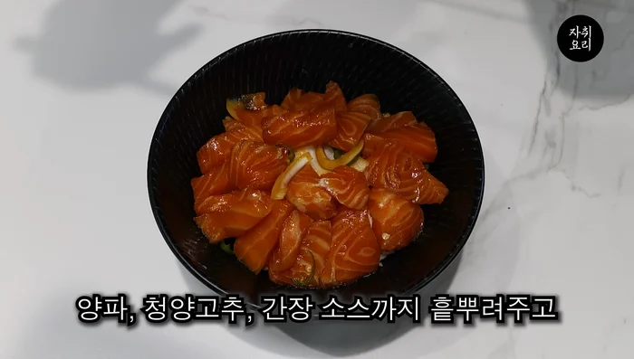 Serve the salmon roe over hot rice, topped with an egg yolk.