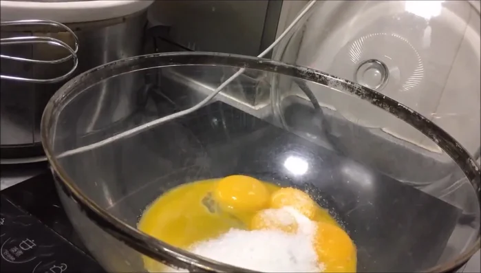 Blend egg yolks with half the sugar.