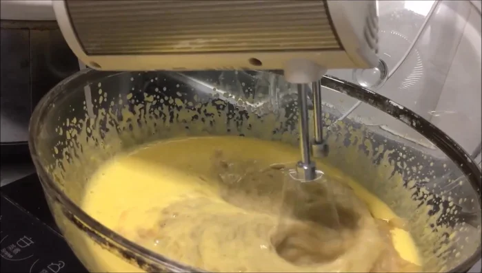 Add mashed bananas and oil to the egg yolk mixture. Combine well.
